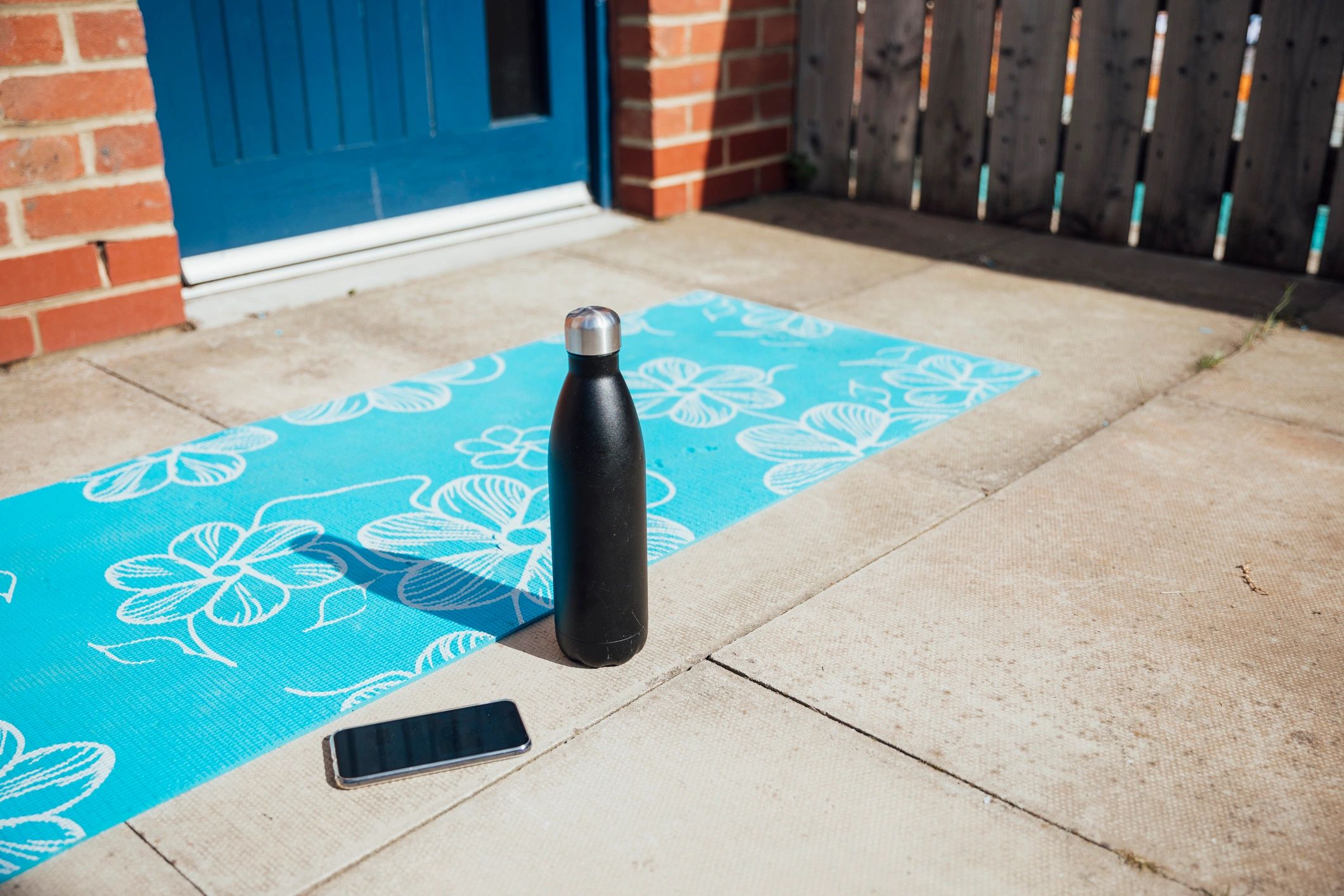 Reusable bottle and notebook on a desk